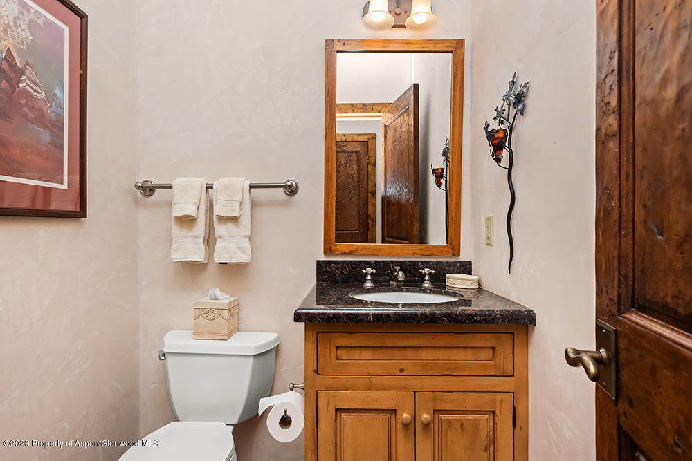 10 Arbaney Ranch Road Basalt, CO 81621 - Photo 7 of 16 a bathroom with a toilet sink and mirror