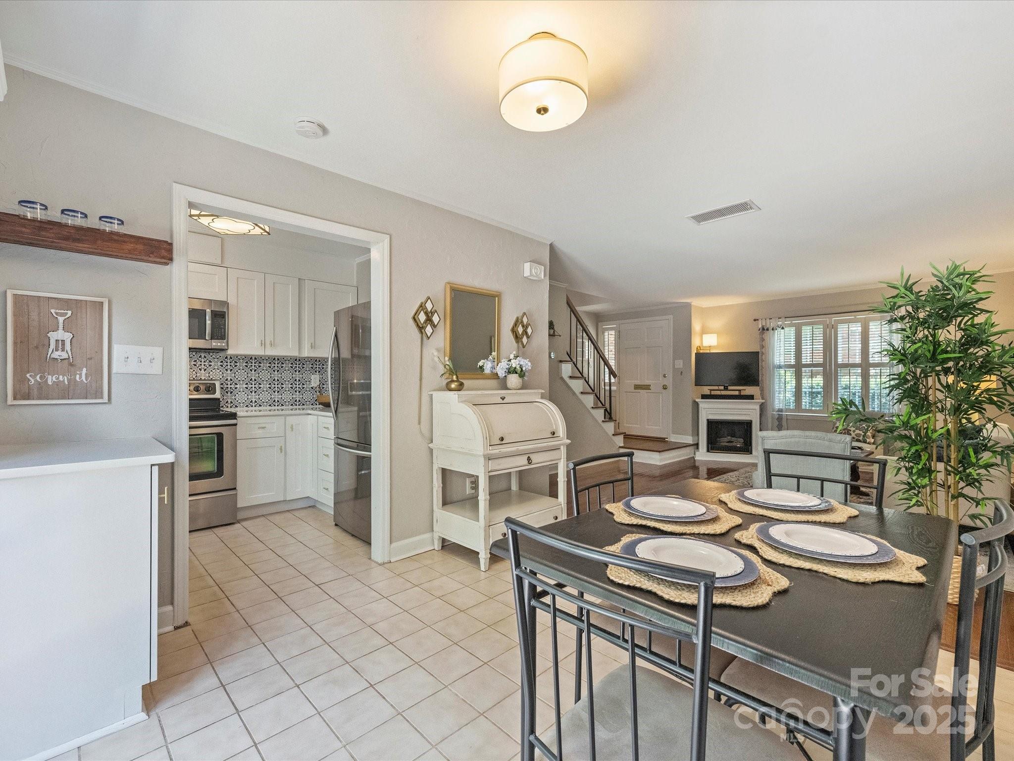 850 McAlway Road, Unit A Charlotte, NC 28211 - Photo 12 of 33 a view of a livingroom with furniture and kitchen view