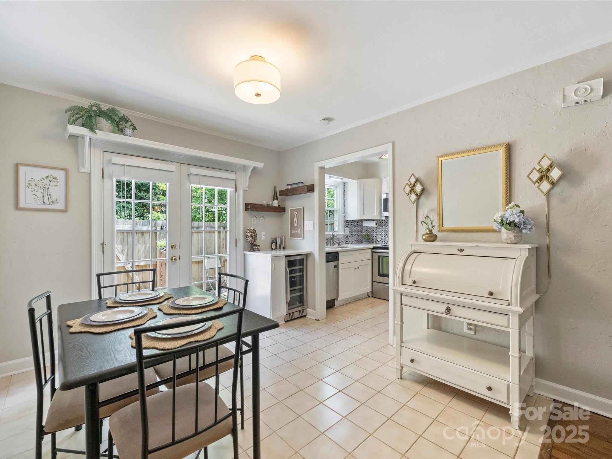 850 McAlway Road, Unit A Charlotte, NC 28211 - Photo 14 of 33 a kitchen with a table chairs and a refrigerator