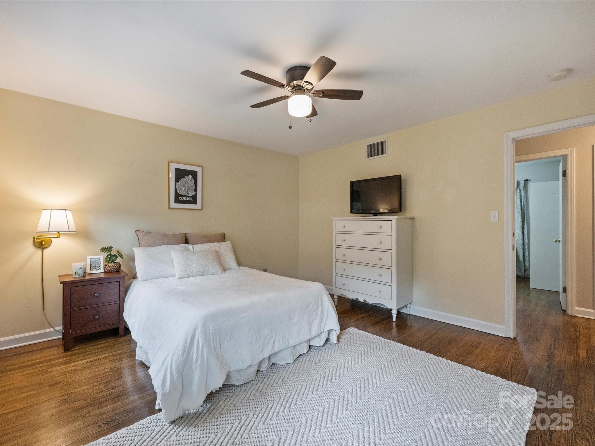 850 McAlway Road, Unit A Charlotte, NC 28211 - Photo 23 of 33 a bedroom with a bed and a flat screen tv