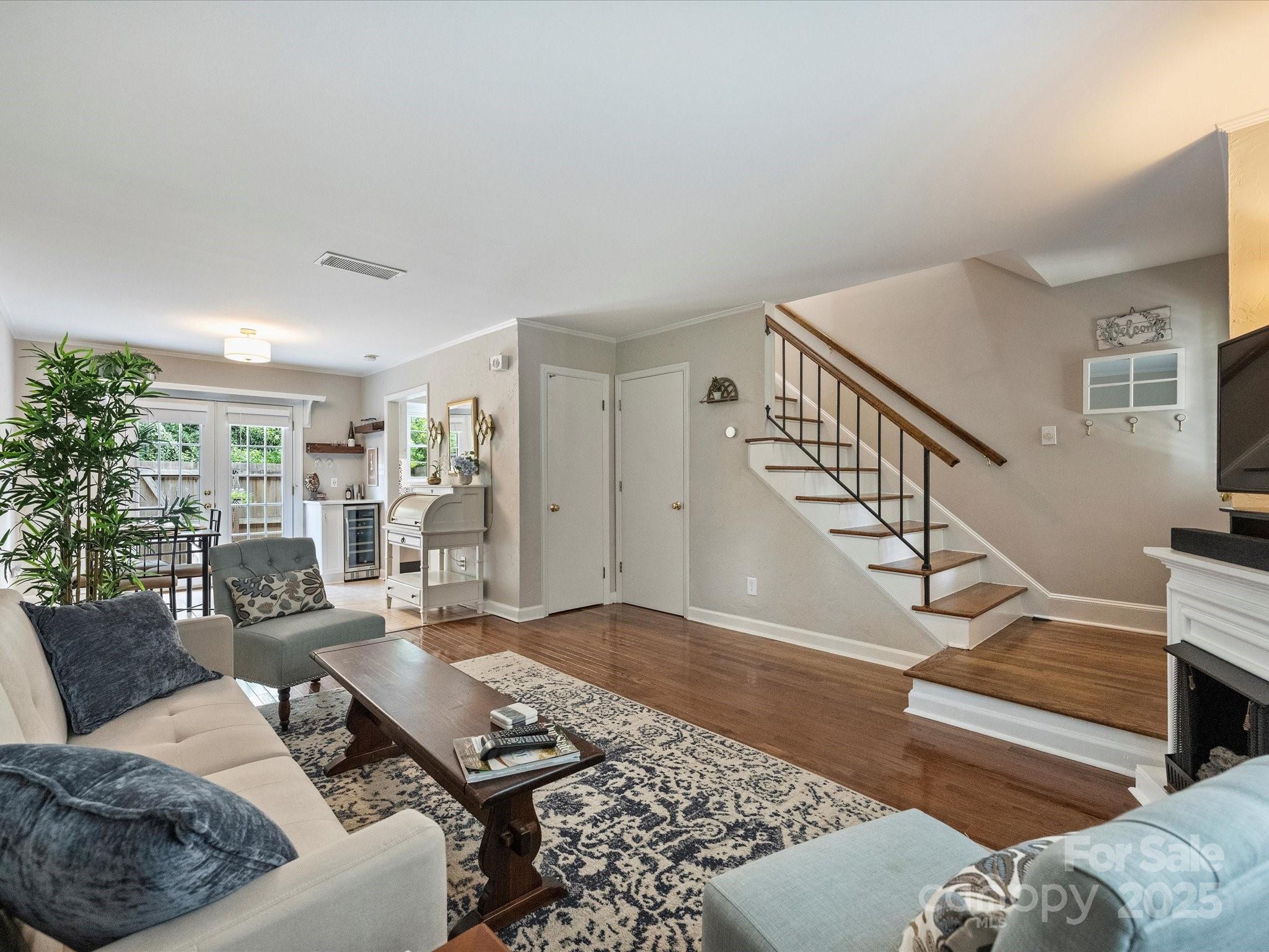 850 McAlway Road, Unit A Charlotte, NC 28211 - Photo 5 of 33 a living room with furniture and wooden floor