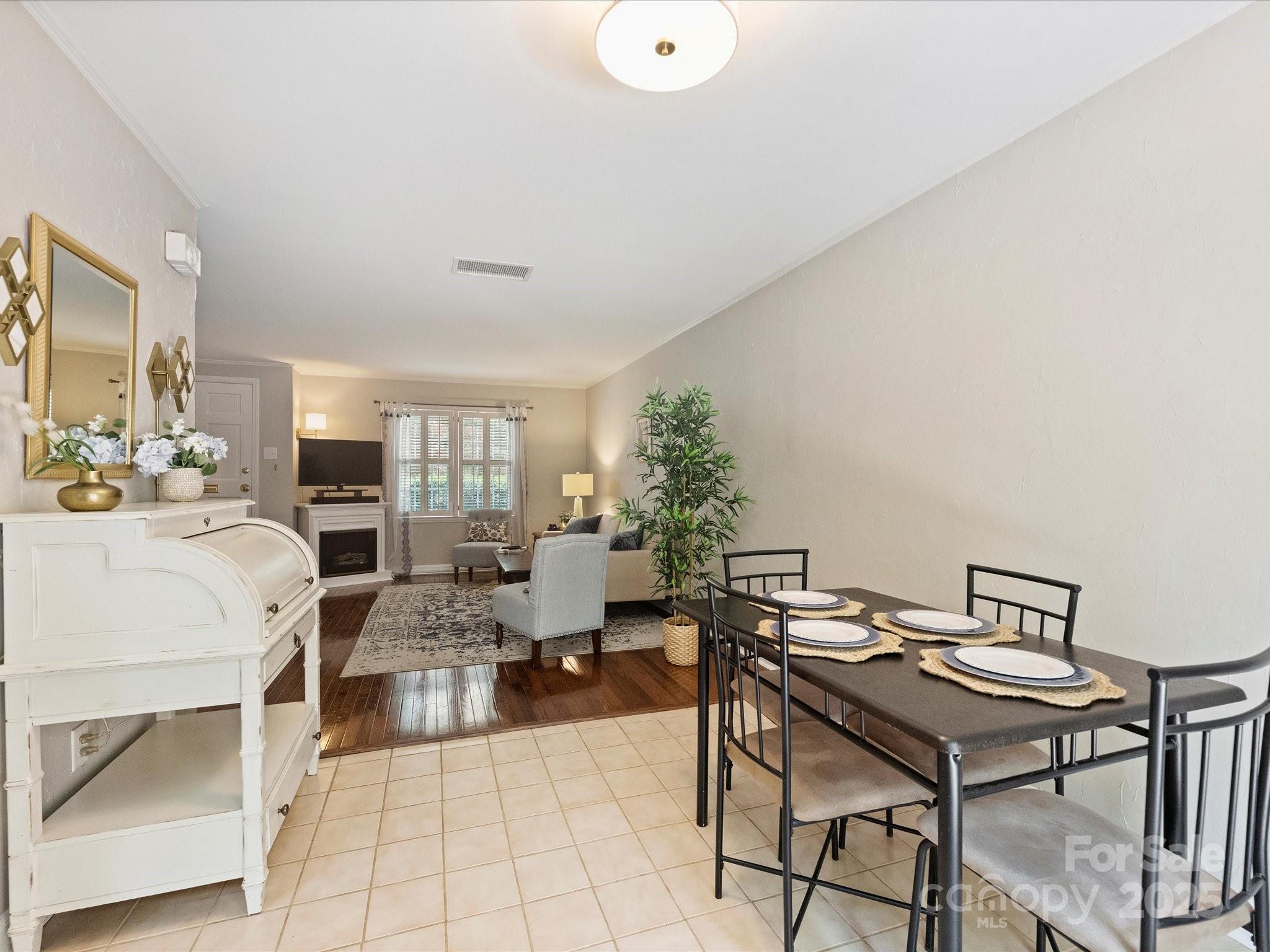 850 McAlway Road, Unit A Charlotte, NC 28211 - Photo 10 of 33 a living room with fireplace furniture and a table