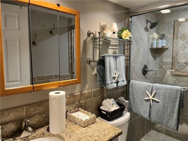 a bathroom with a bathtub and shower