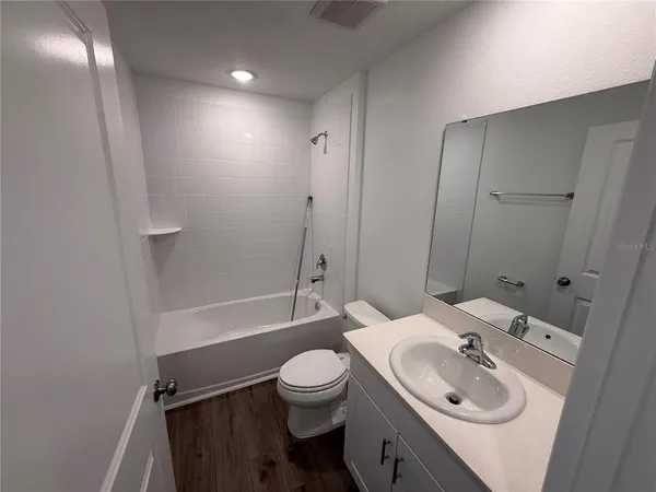 a stove top oven sitting inside of a kitchen