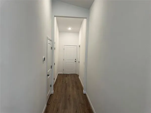 a view of a bathroom from the hallway