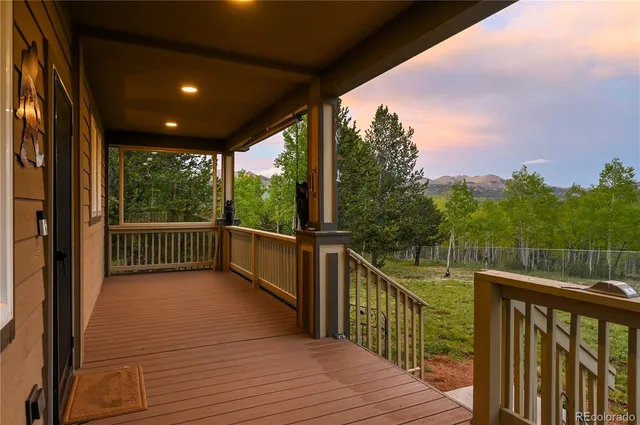 a view of a balcony with wooden floor
