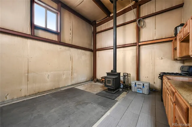 a view of a hallway with wooden floor and entryway