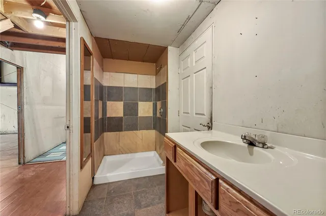 a street view with large trees