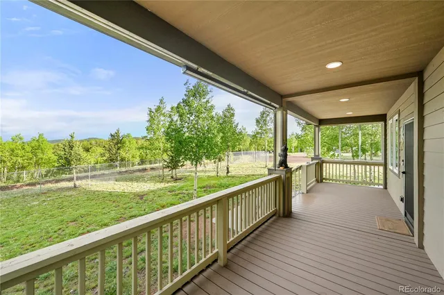 a view of balcony with yard