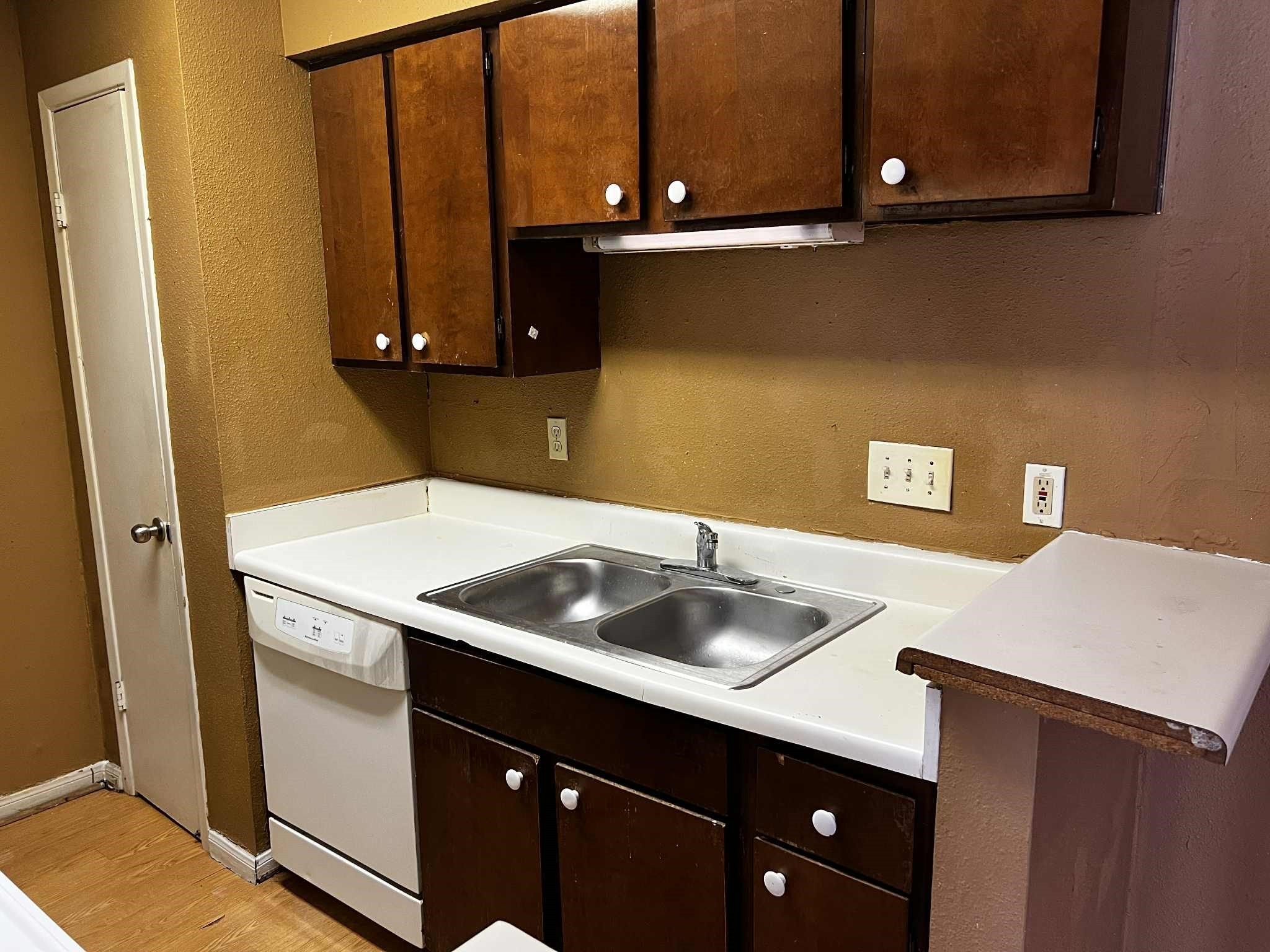 2100 Wilcrest Drive, Unit 114 Houston, TX 77077 - Photo 5 of 13 a kitchen with a sink and cabinets