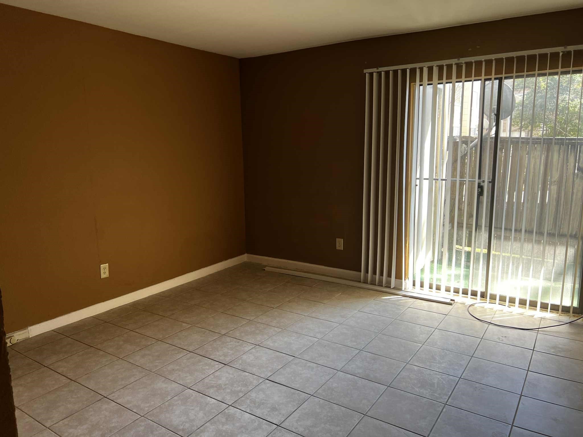 2100 Wilcrest Drive, Unit 114 Houston, TX 77077 - Photo 8 of 13 a view of an empty room and window