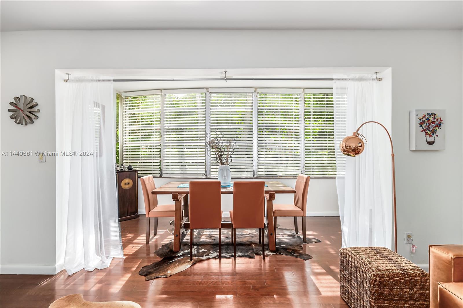 4800 Pine Tree Drive, Unit 101 Miami Beach, FL 33140 - Photo 12 of 30 a dining room with furniture and window