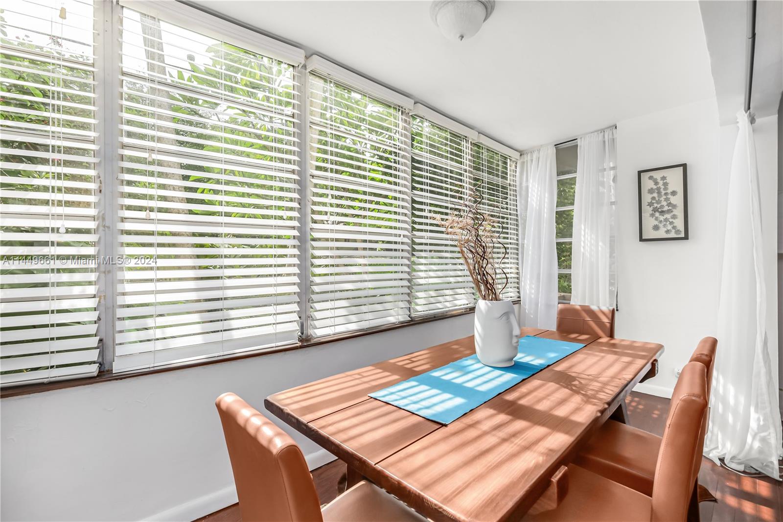 4800 Pine Tree Drive, Unit 101 Miami Beach, FL 33140 - Photo 13 of 30 a view of a dining room with furniture and window