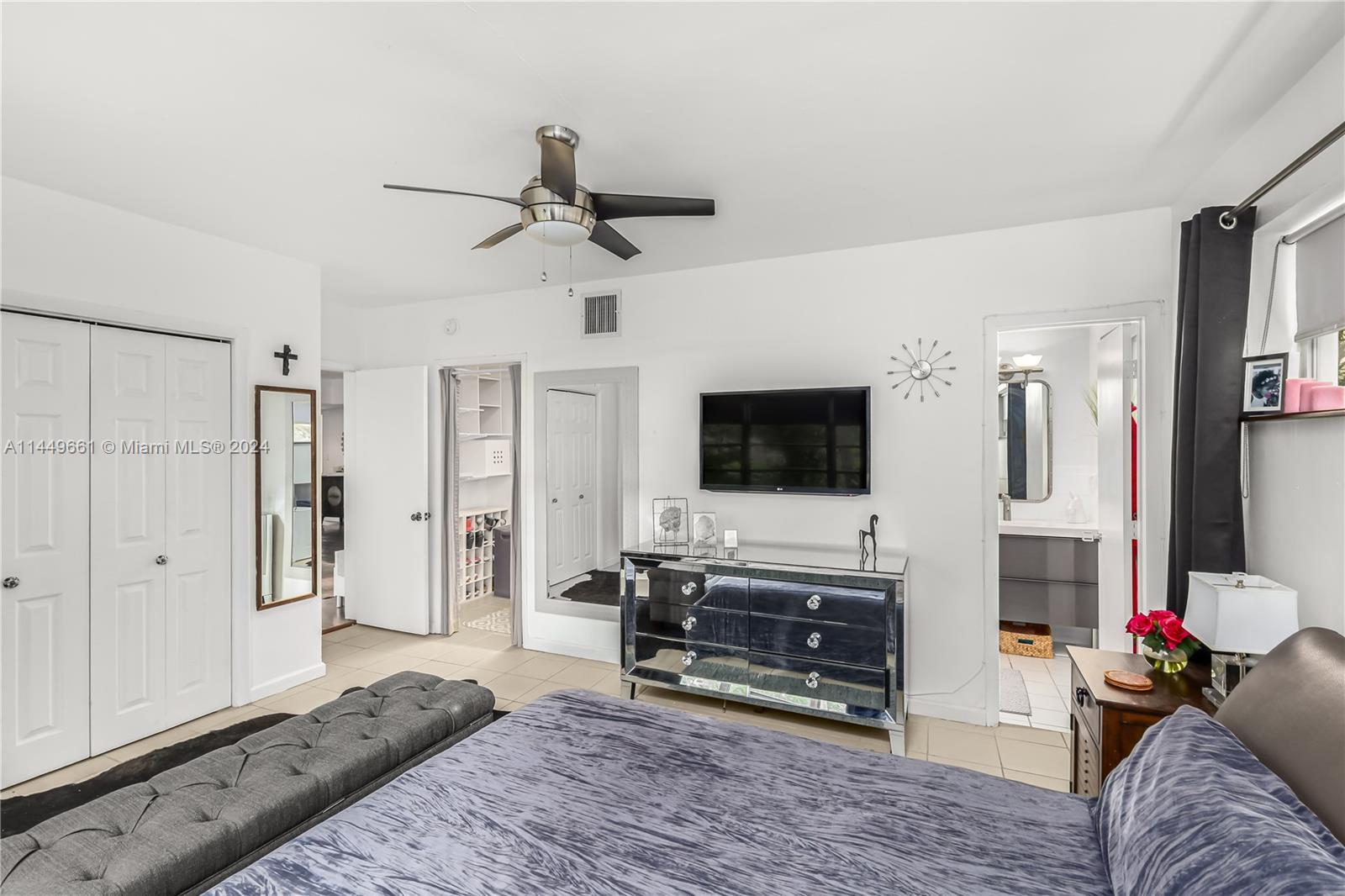 4800 Pine Tree Drive, Unit 101 Miami Beach, FL 33140 - Photo 15 of 30 a living room with furniture and a flat screen tv