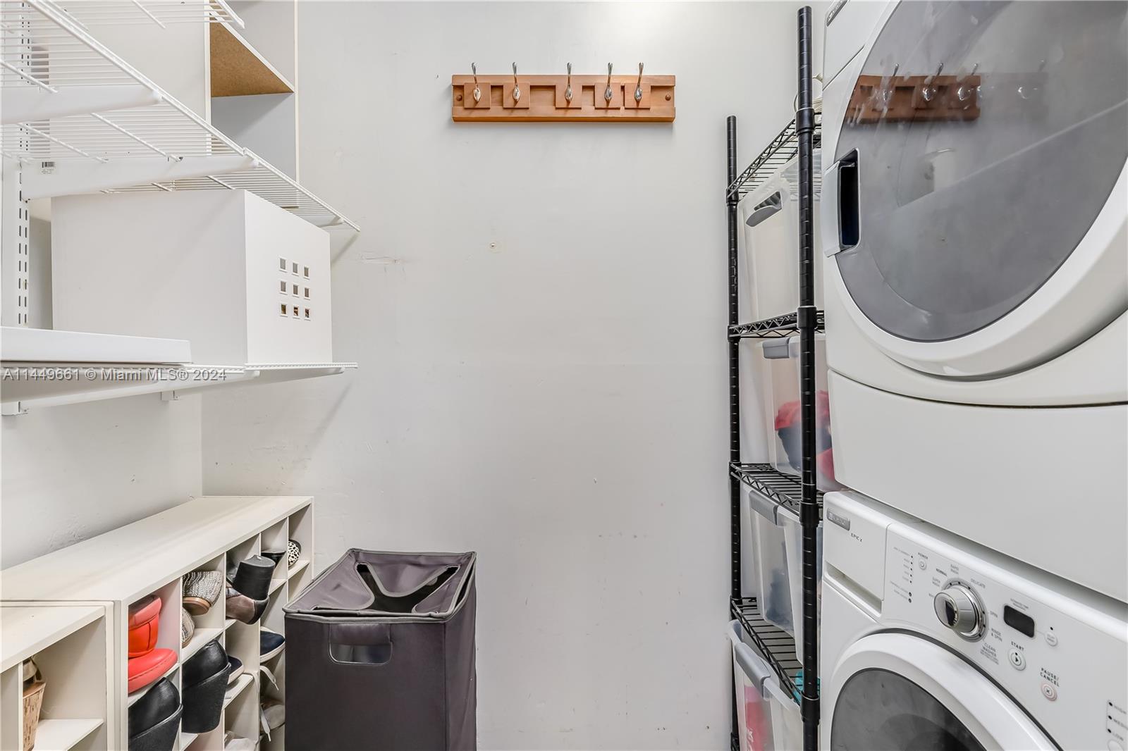 4800 Pine Tree Drive, Unit 101 Miami Beach, FL 33140 - Photo 18 of 30 a utility room with dryer and washer