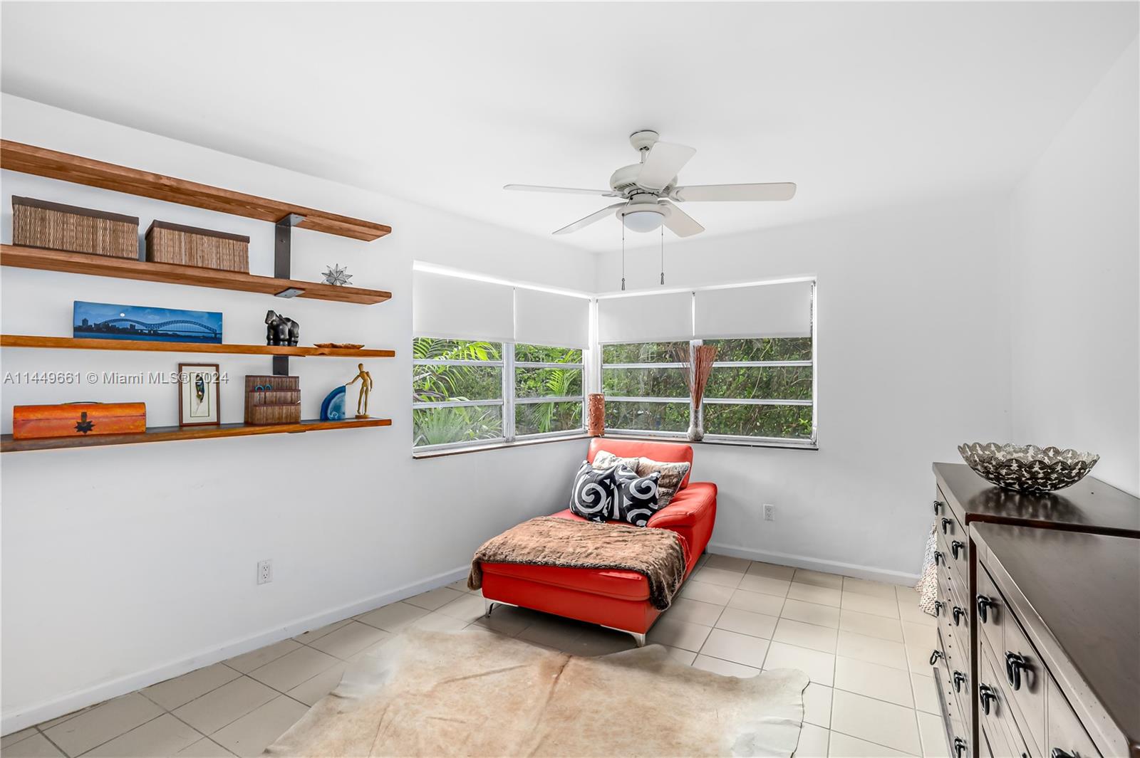 4800 Pine Tree Drive, Unit 101 Miami Beach, FL 33140 - Photo 19 of 30 a bedroom with furniture and window