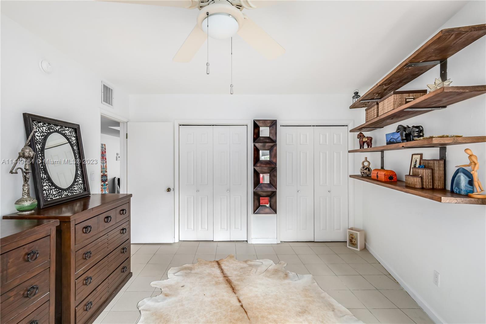 4800 Pine Tree Drive, Unit 101 Miami Beach, FL 33140 - Photo 20 of 30 a view of room with window and cabinet