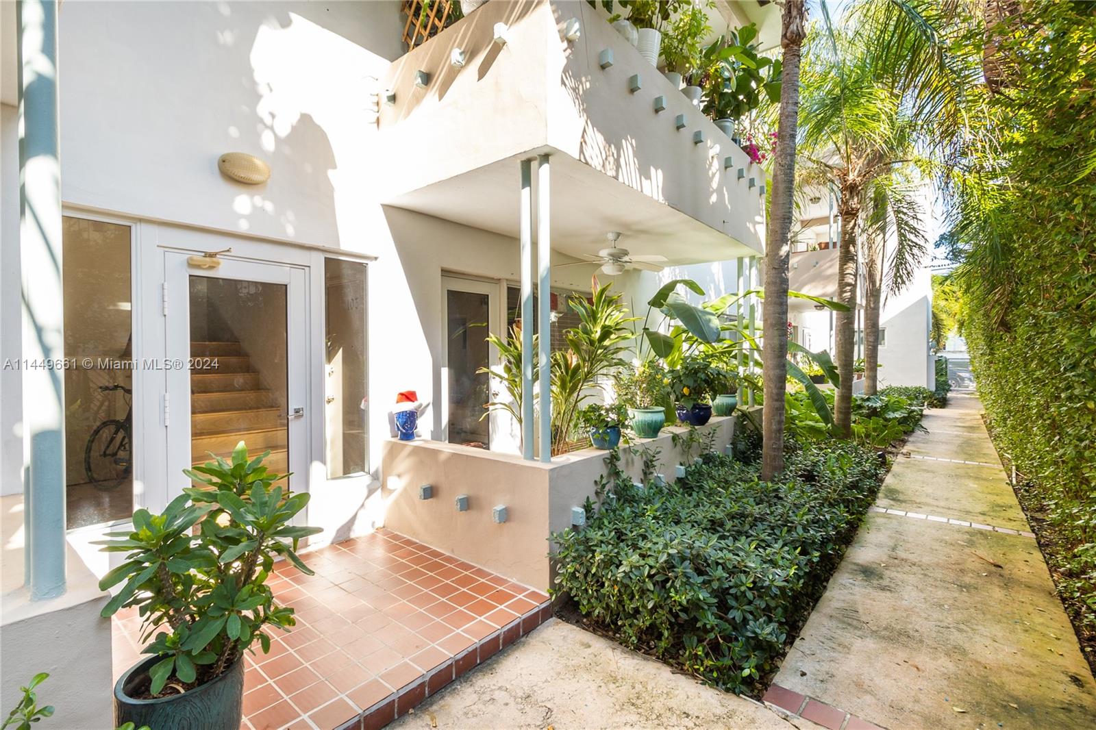 4800 Pine Tree Drive, Unit 101 Miami Beach, FL 33140 - Photo 2 of 30 a front view of a house with a yard