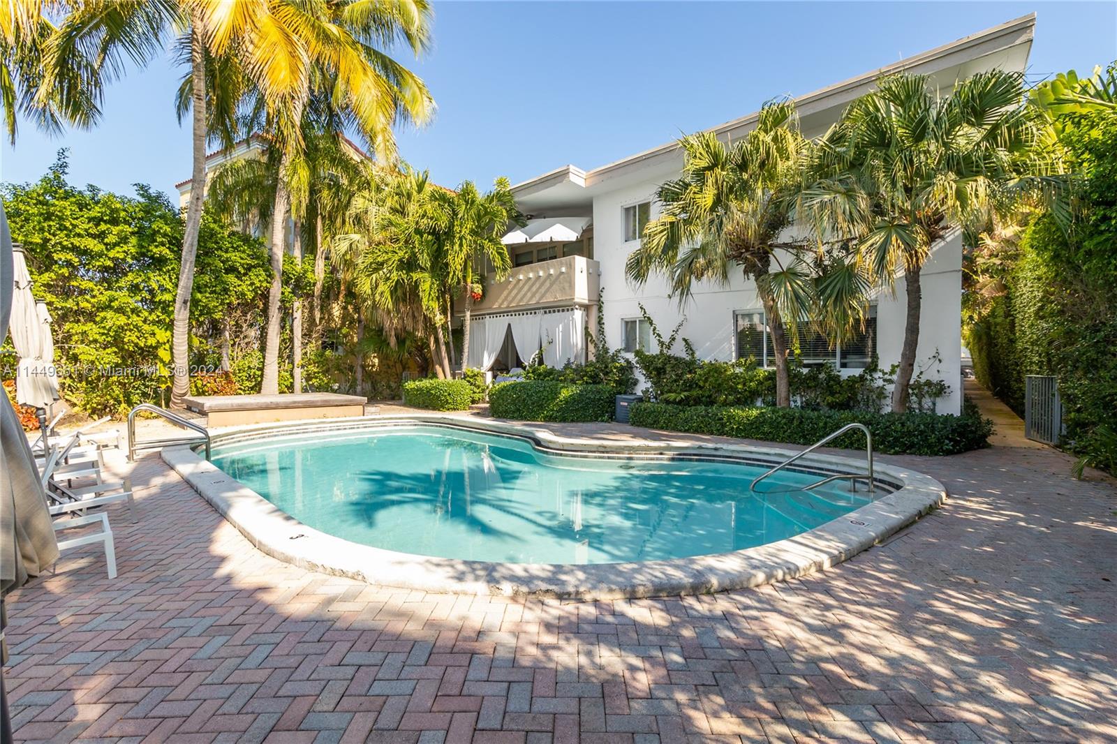 4800 Pine Tree Drive, Unit 101 Miami Beach, FL 33140 - Photo 26 of 30 a view of outdoor space yard swimming pool and patio
