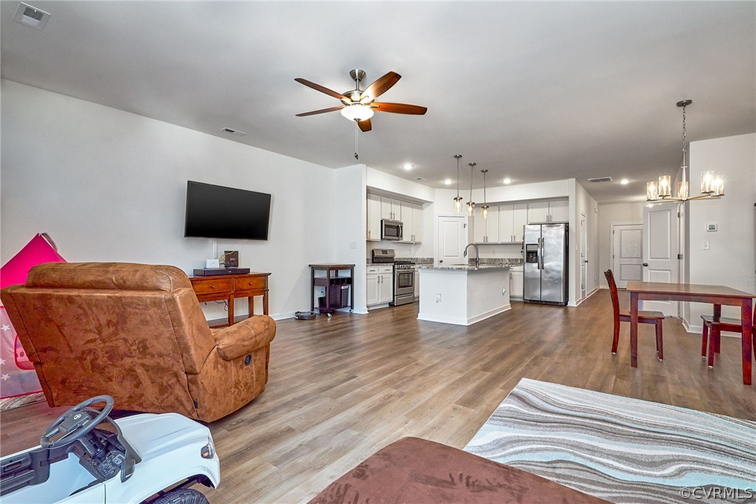 114 Two Penny Place Williamsburg, VA 23185 - Photo 11 of 25 a living room with furniture and a flat screen tv