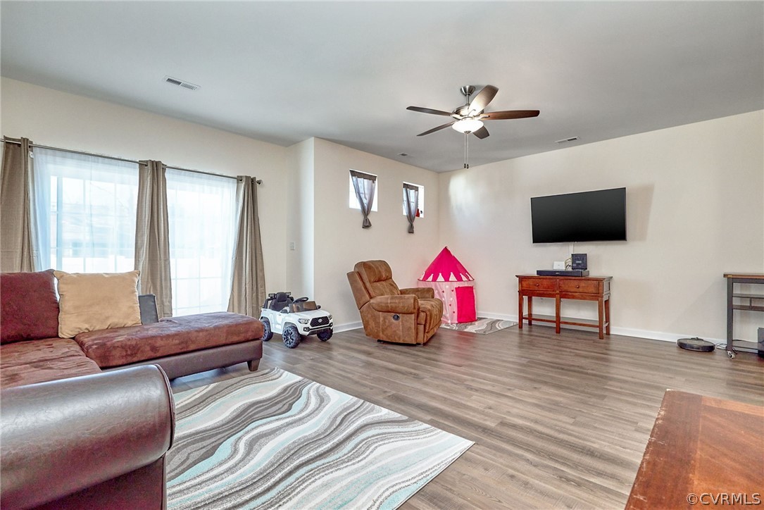 114 Two Penny Place Williamsburg, VA 23185 - Photo 12 of 25 a living room with furniture and a flat screen tv
