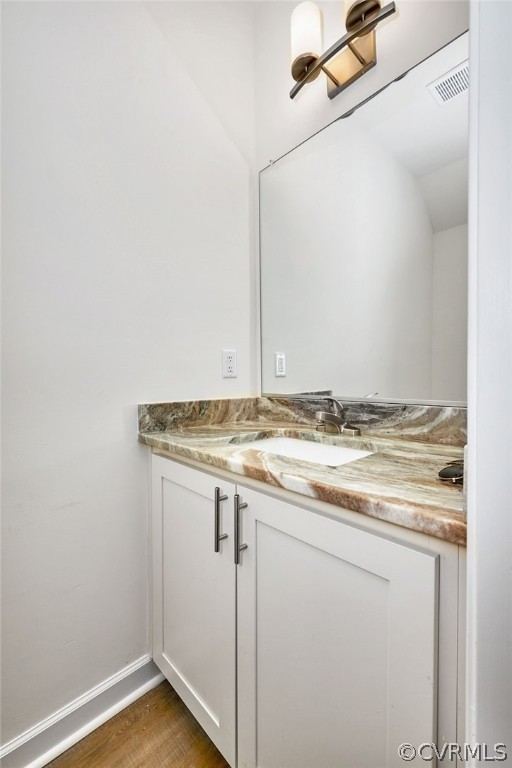 114 Two Penny Place Williamsburg, VA 23185 - Photo 13 of 25 a bathroom with a granite countertop sink and white cabinets