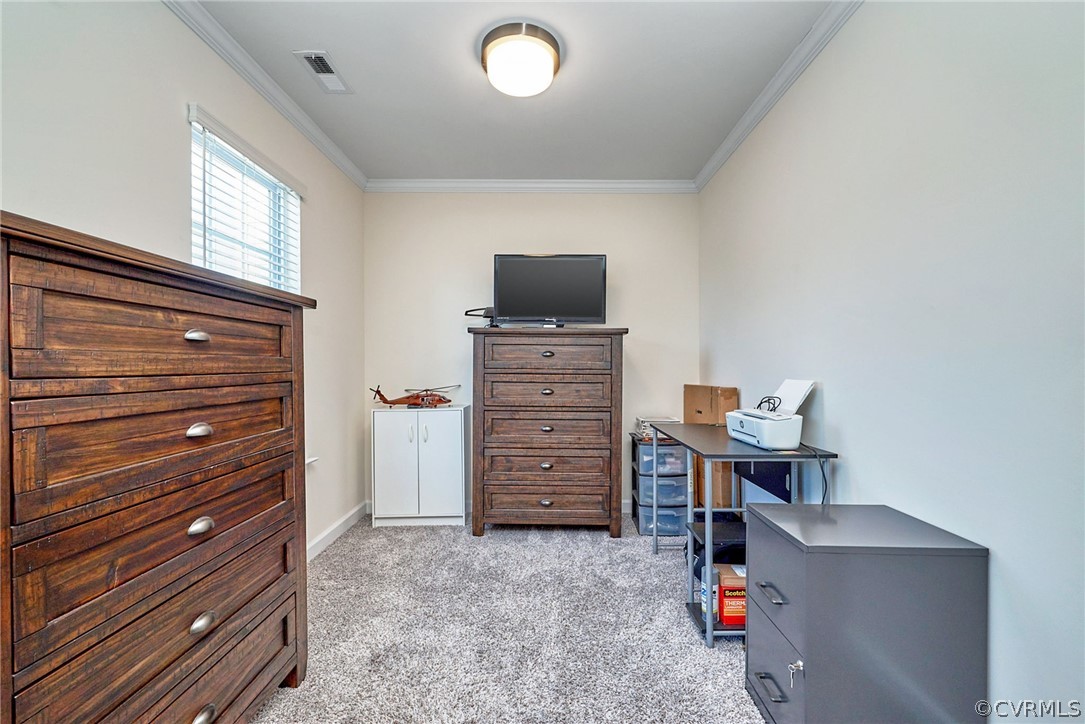 114 Two Penny Place Williamsburg, VA 23185 - Photo 20 of 25 a room with a dresser and a chair