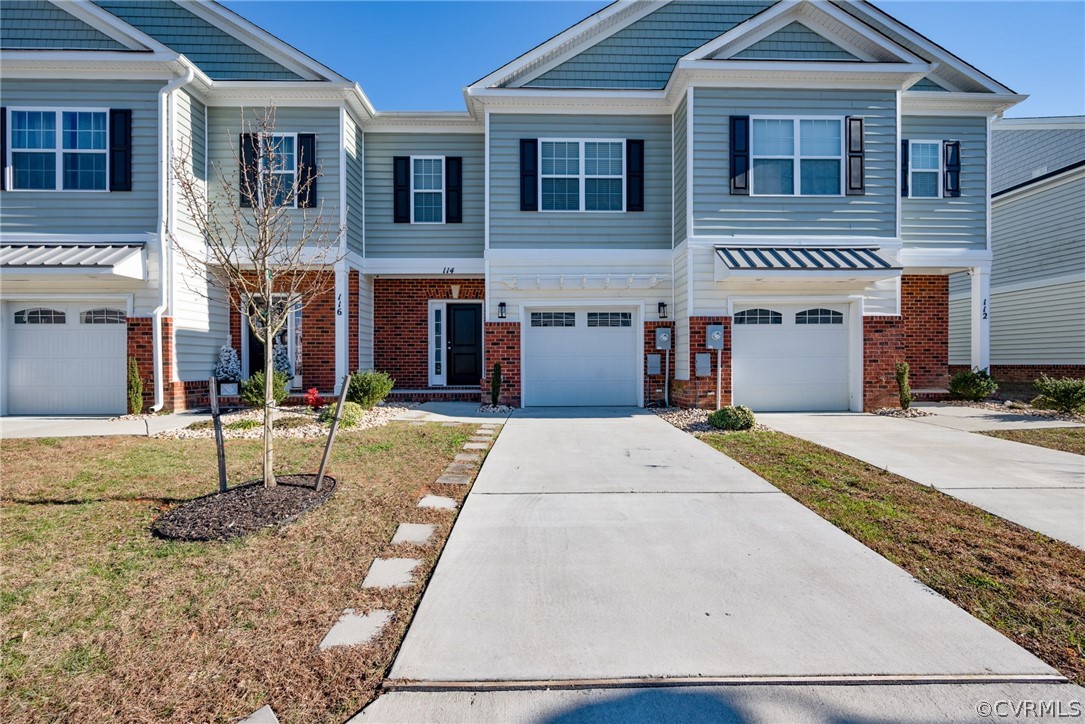 114 Two Penny Place Williamsburg, VA 23185 - Photo 2 of 25 a front view of a house with a yard
