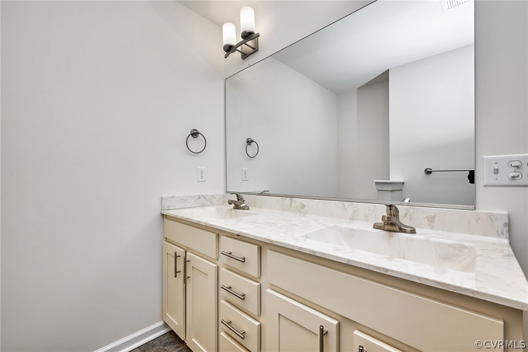 114 Two Penny Place Williamsburg, VA 23185 - Photo 22 of 25 a bathroom with a sink and a mirror