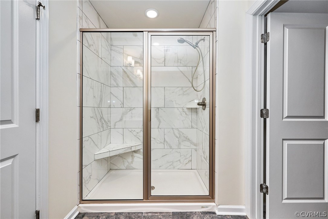 114 Two Penny Place Williamsburg, VA 23185 - Photo 23 of 25 a bathroom with a glass shower door