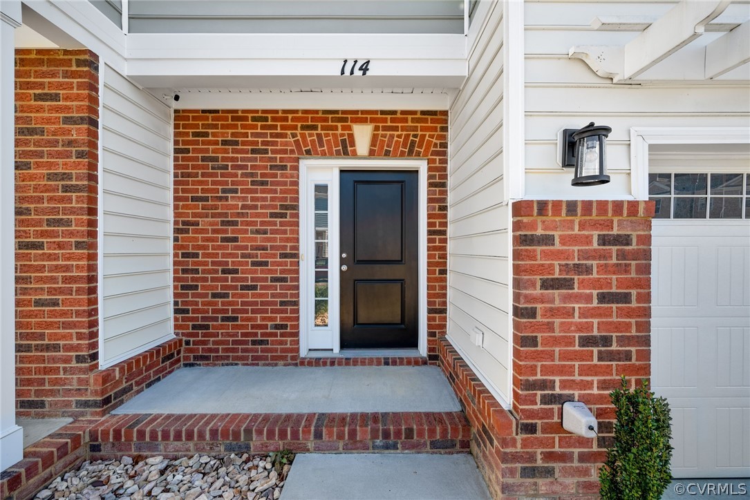 114 Two Penny Place Williamsburg, VA 23185 - Photo 4 of 25 a front view of a building with a window