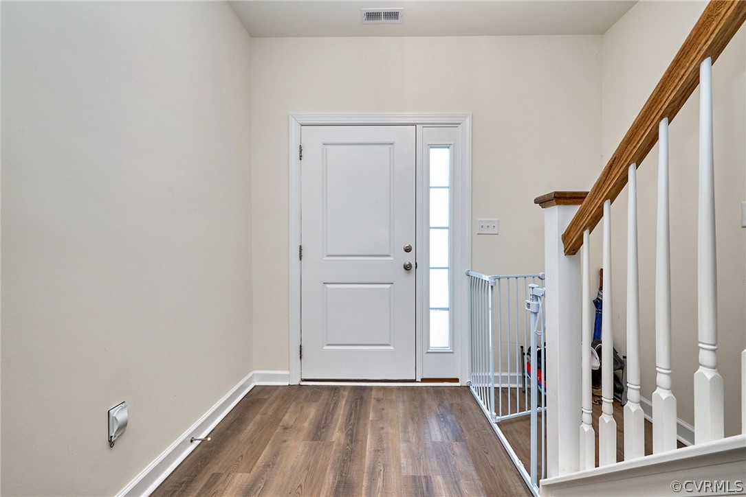 114 Two Penny Place Williamsburg, VA 23185 - Photo 5 of 25 a view of a hallway with wooden floor and stairs