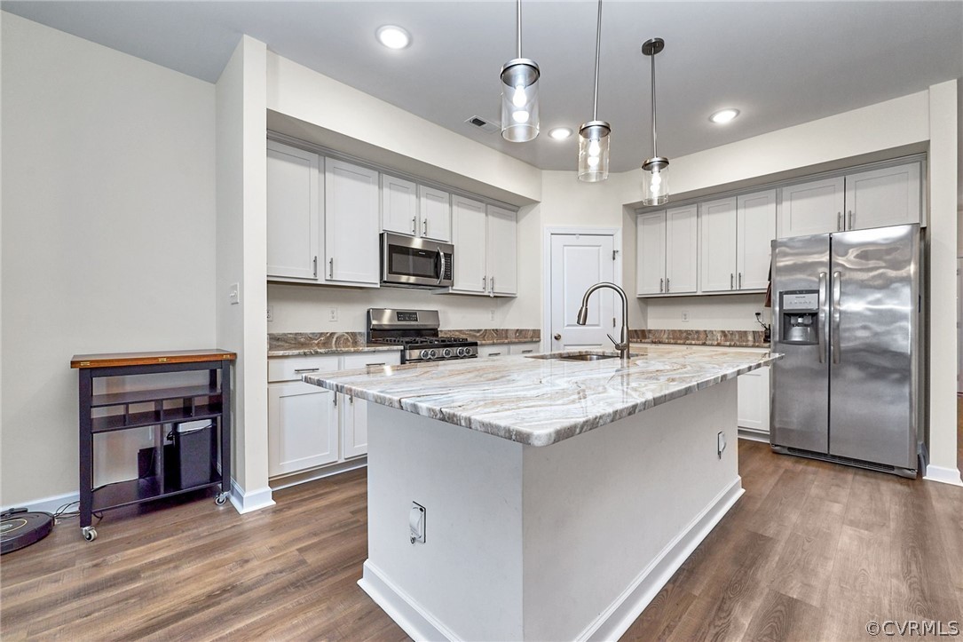 114 Two Penny Place Williamsburg, VA 23185 - Photo 7 of 25 a kitchen with kitchen island granite countertop a sink stainless steel appliances and cabinets