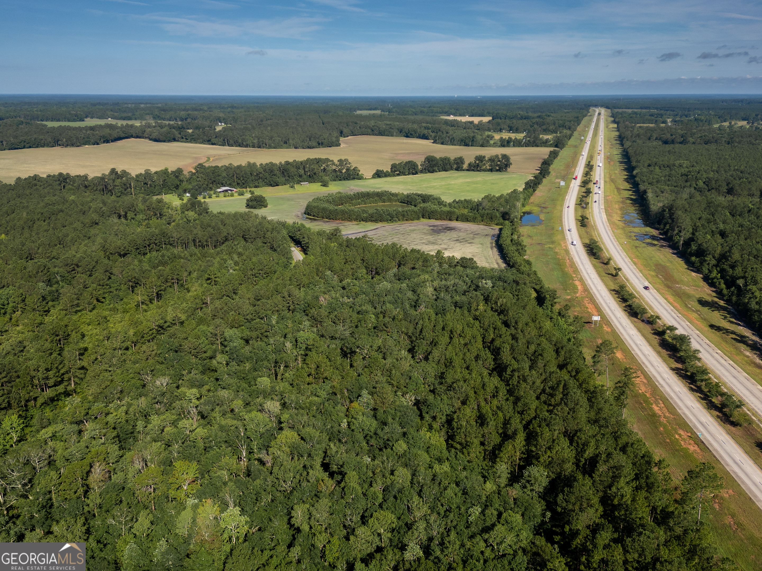5185 Old Groveland Road Pembroke, GA 31321 - Photo 11 of 25 a view of a lake with outdoor space