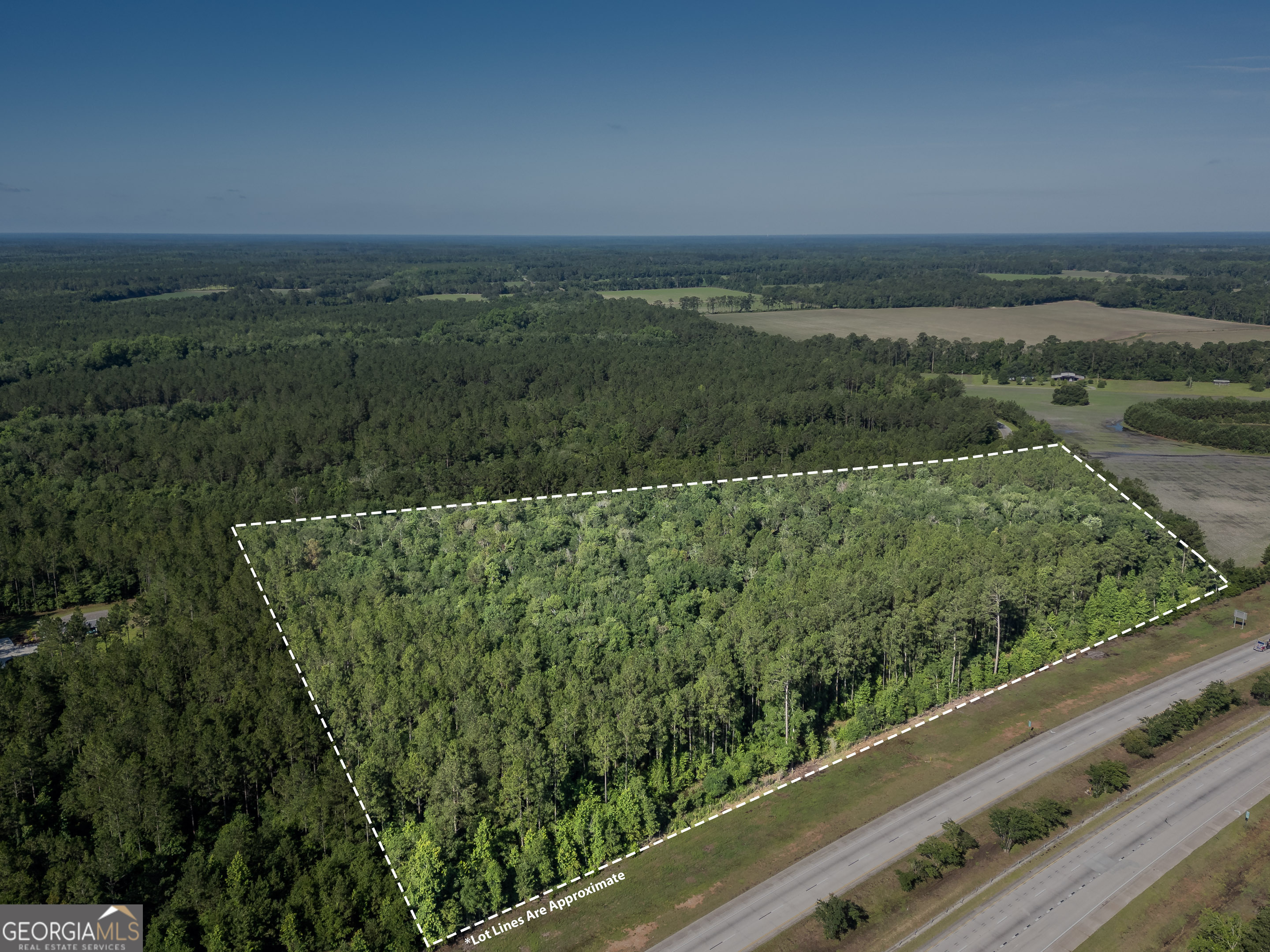 5185 Old Groveland Road Pembroke, GA 31321 - Photo 12 of 25 a view of a green field with an outdoor space