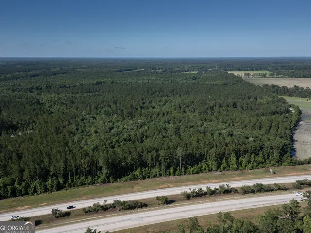 an aerial view of a house and lake view