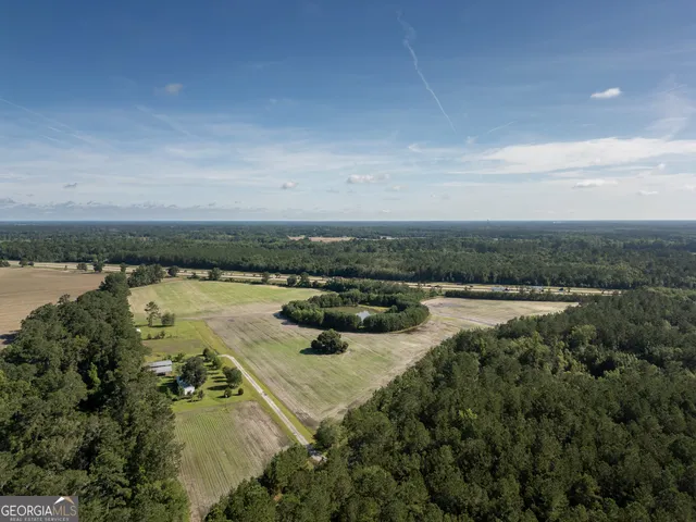 a view of a lake with beach and city view