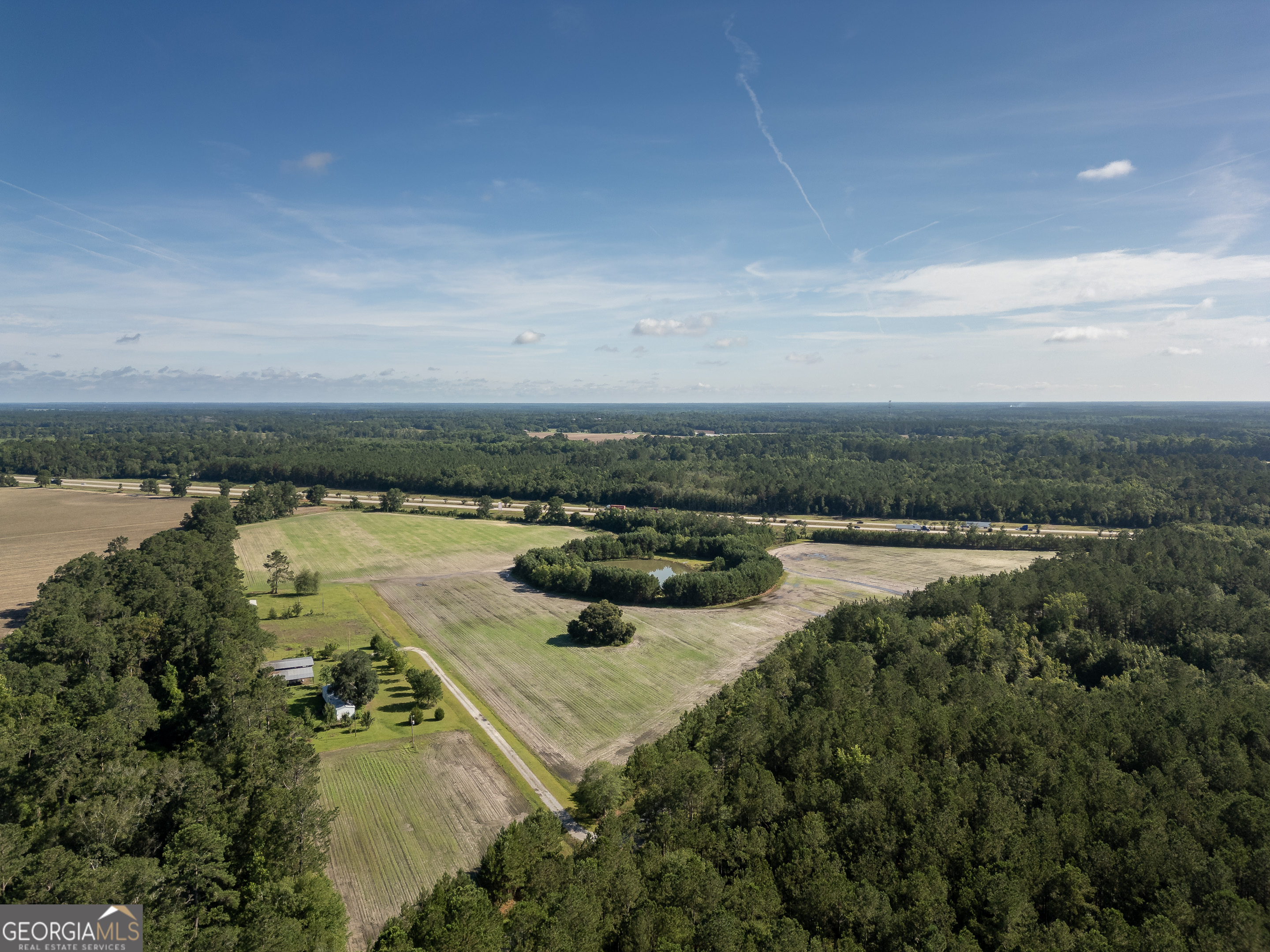 5185 Old Groveland Road Pembroke, GA 31321 - Photo 16 of 25 a view of a lake with outdoor space