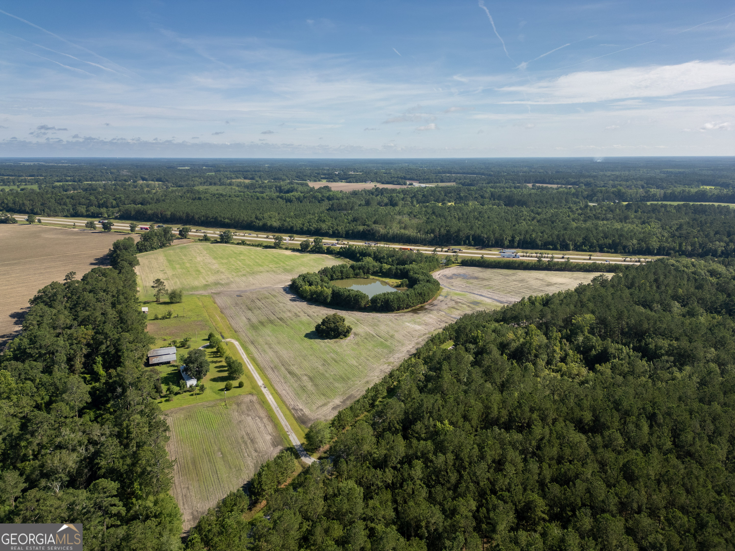5185 Old Groveland Road Pembroke, GA 31321 - Photo 20 of 25 a view of a lake with outdoor space