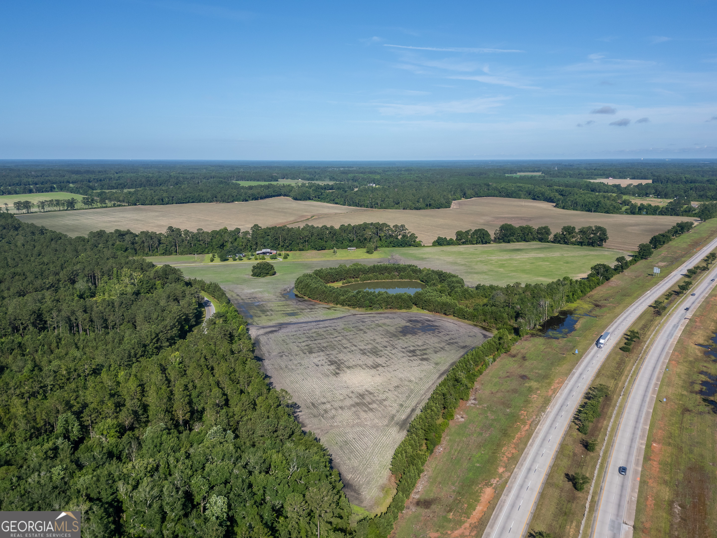 5185 Old Groveland Road Pembroke, GA 31321 - Photo 2 of 25 a view of a field with an ocean