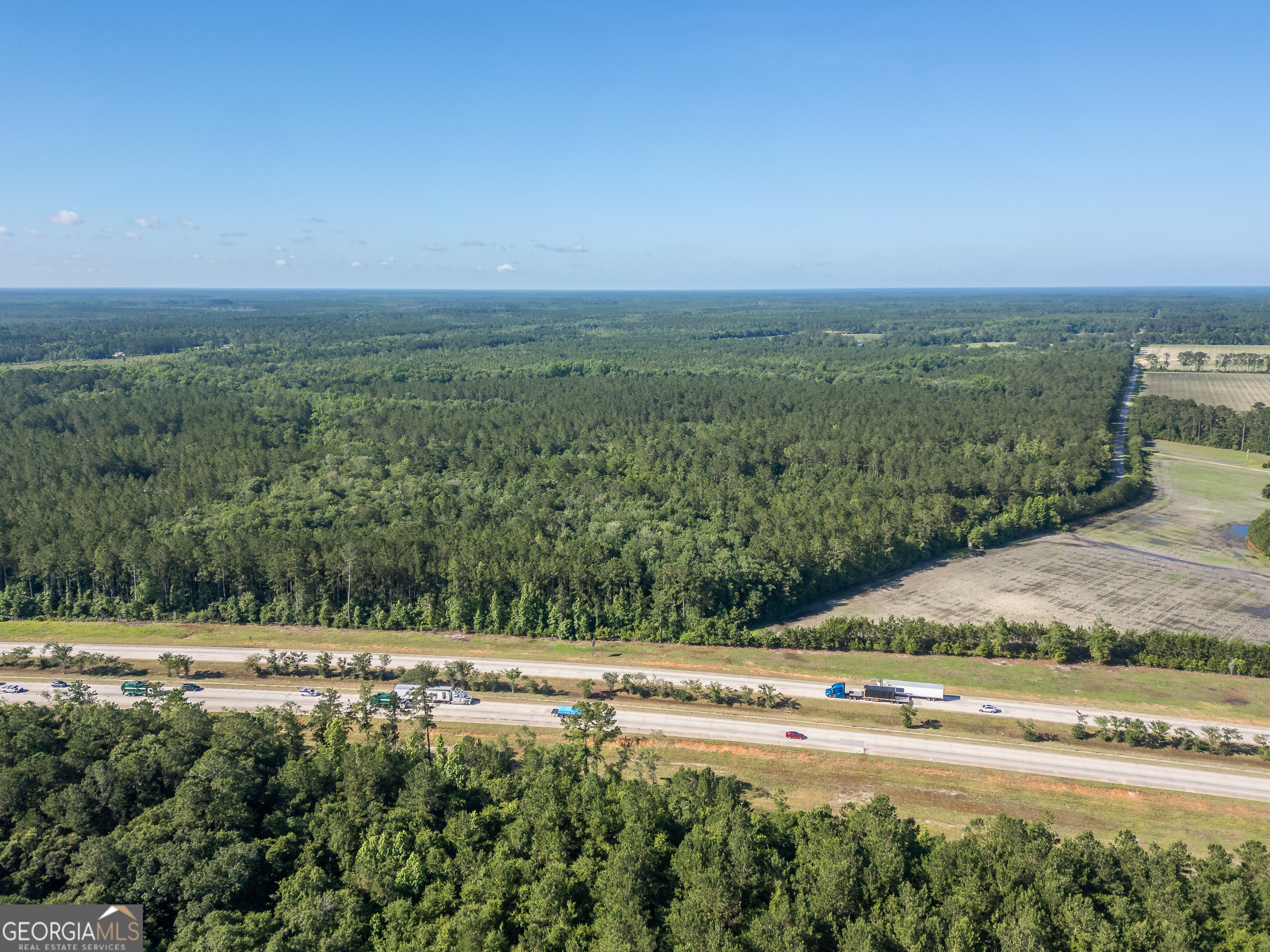 5185 Old Groveland Road Pembroke, GA 31321 - Photo 4 of 25 a view of a field with an ocean