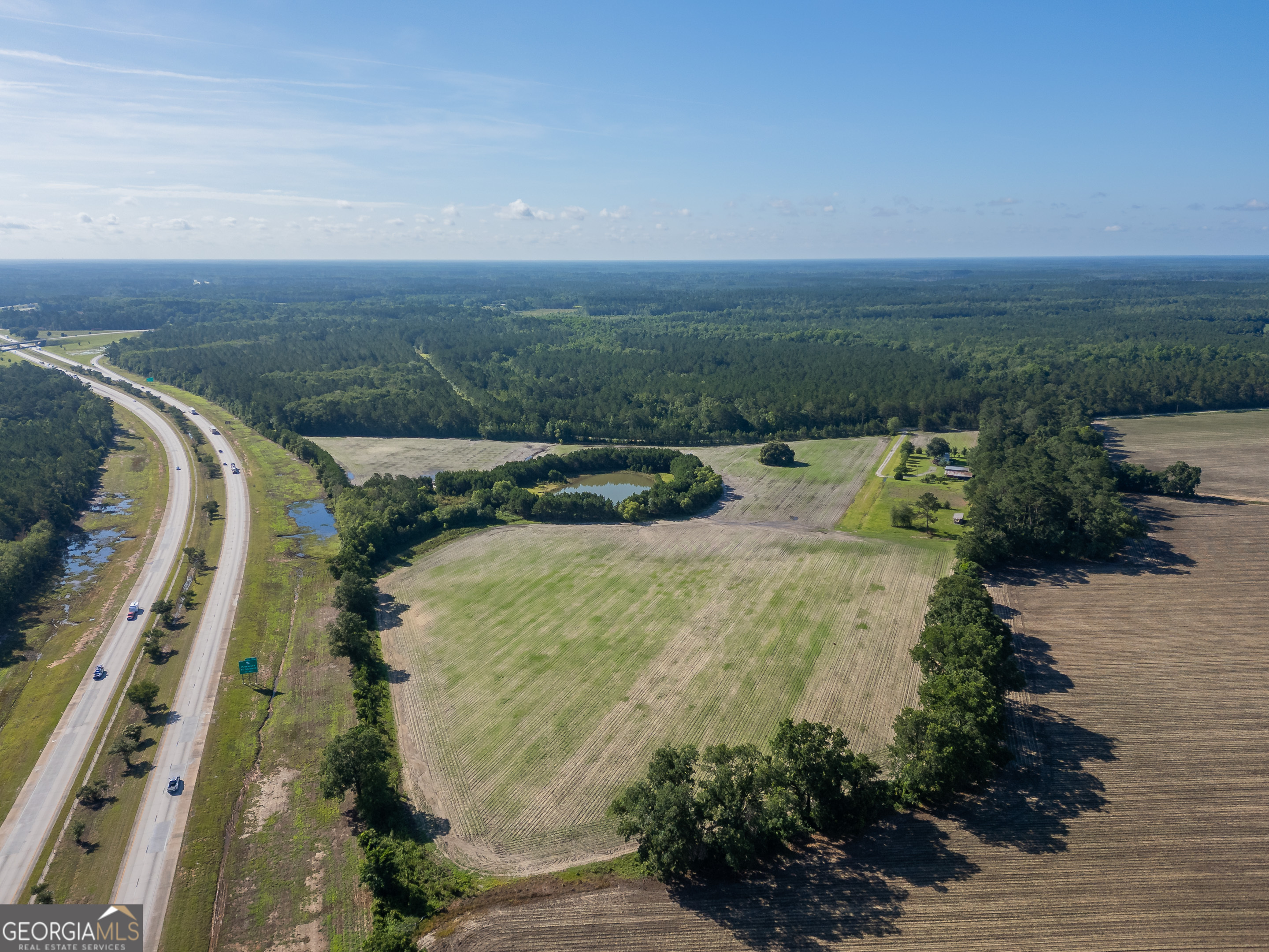 5185 Old Groveland Road Pembroke, GA 31321 - Photo 6 of 25 a view of a yard with an outdoor space