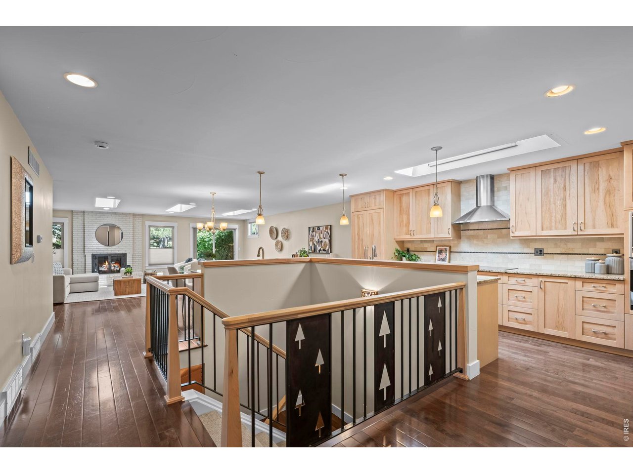 4824 Briar Ridge Court Boulder, CO 80301 - Photo 23 of 40 a open kitchen with kitchen island wooden floors and stainless steel appliances