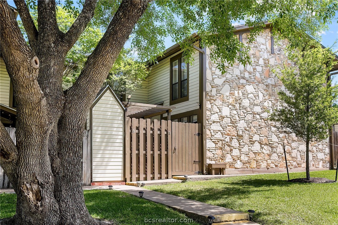 2411 De Lee Street, Unit 5 Bryan, TX 77802 - Photo 1 of 1 a view of a house with a yard