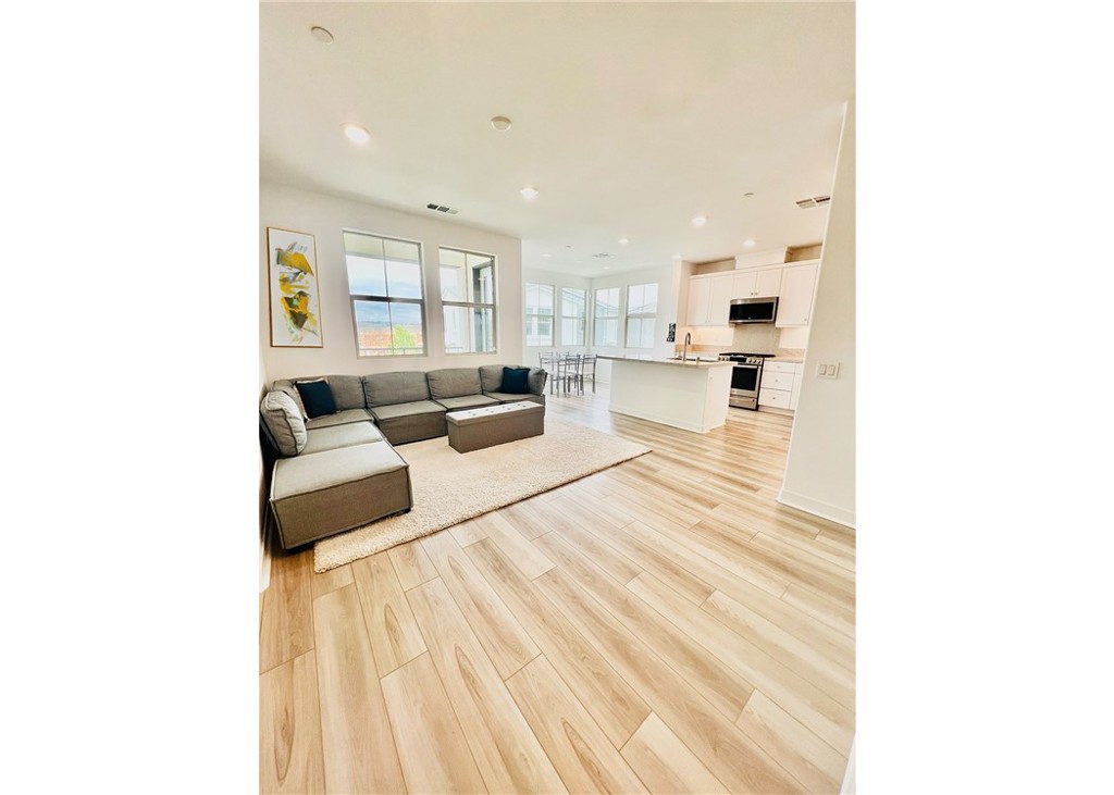 1000 Lasso Way, Unit 305 Rancho Mission Viejo, CA 92694 - Photo 1 of 1 a living room with furniture and a couch