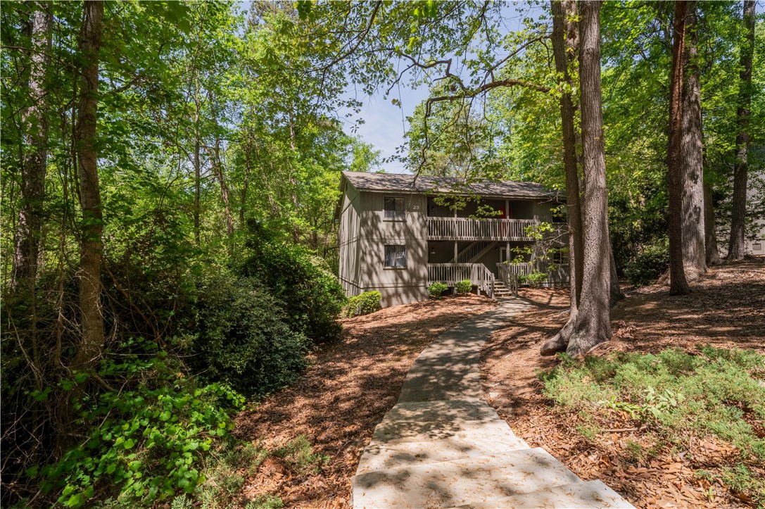 150 Ligon Street, Unit 2302 Clemson, SC 29631 - Photo 1 of 18 This multi-story dwelling is nestled within a lush, verdant landscape, offering a serene escape.