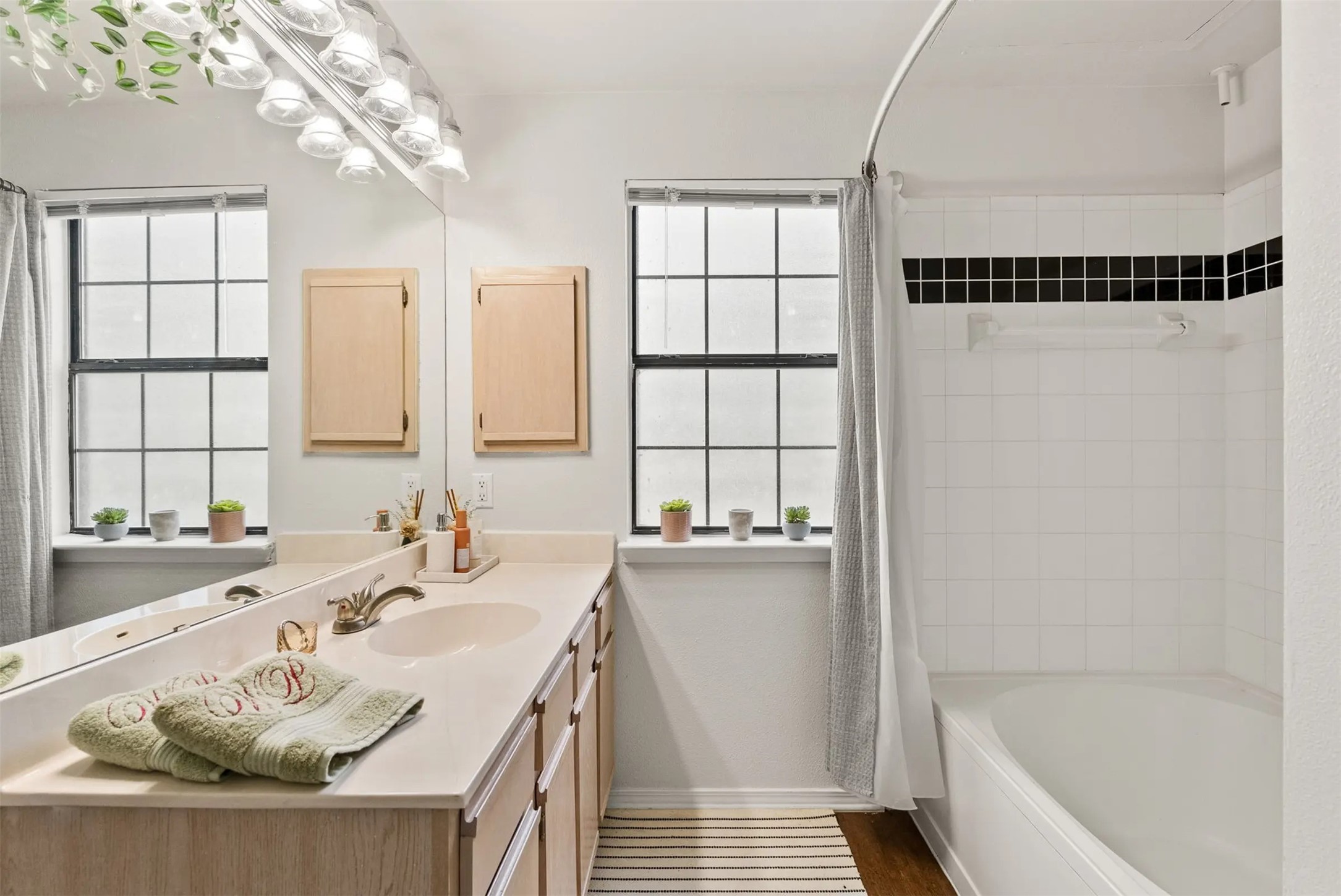 3401 West Parmer Lane, Unit 313 Austin, TX 78727 - Photo 13 of 16 a bathroom with a tub sink and window