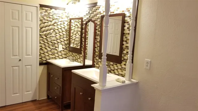 a bathroom with a shower and a sink