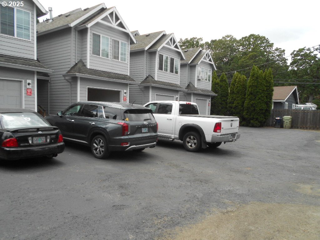 a view of a cars parked in front of a house