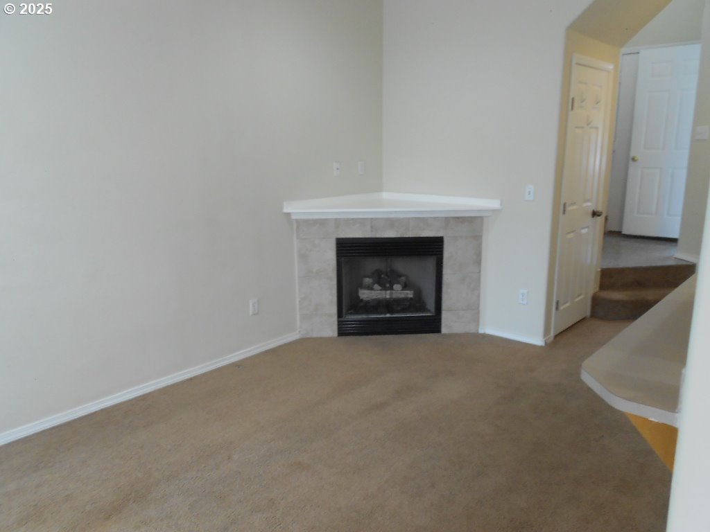 18440 Southwest Johnson Street Beaverton, OR 97003 - Photo 2 of 10 a view of an empty room with a fireplace